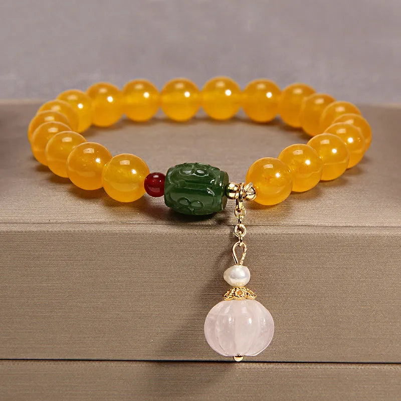Khaki yellow agate crystal bead bracelet on an adjustable gold silk cord.