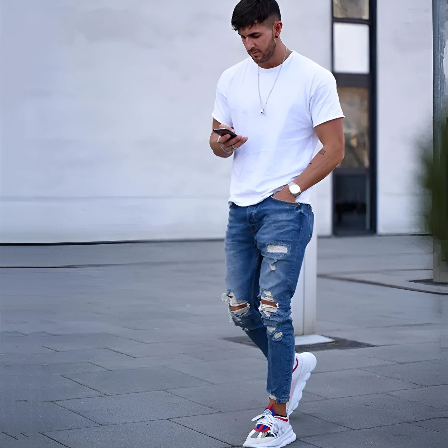 Men's distressed jeans with holes in deep blue colour showing cotton denim construction and sizing options from S to 3XL