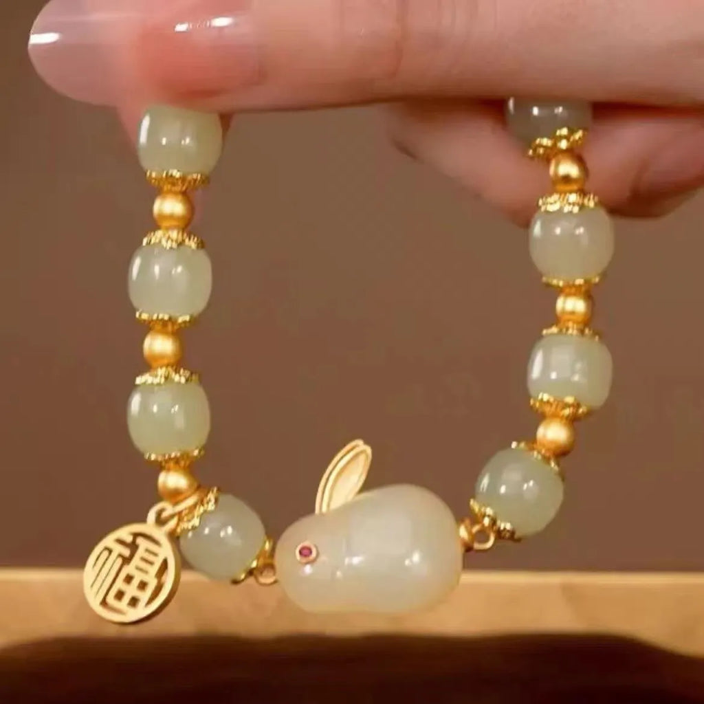 Women's green lucky jade hare bracelet with black elasticated cord