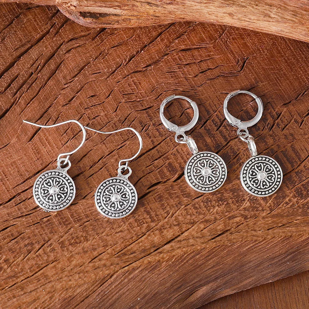 Geometric round women's earrings with distressed ethnic print in retro bohemian style.