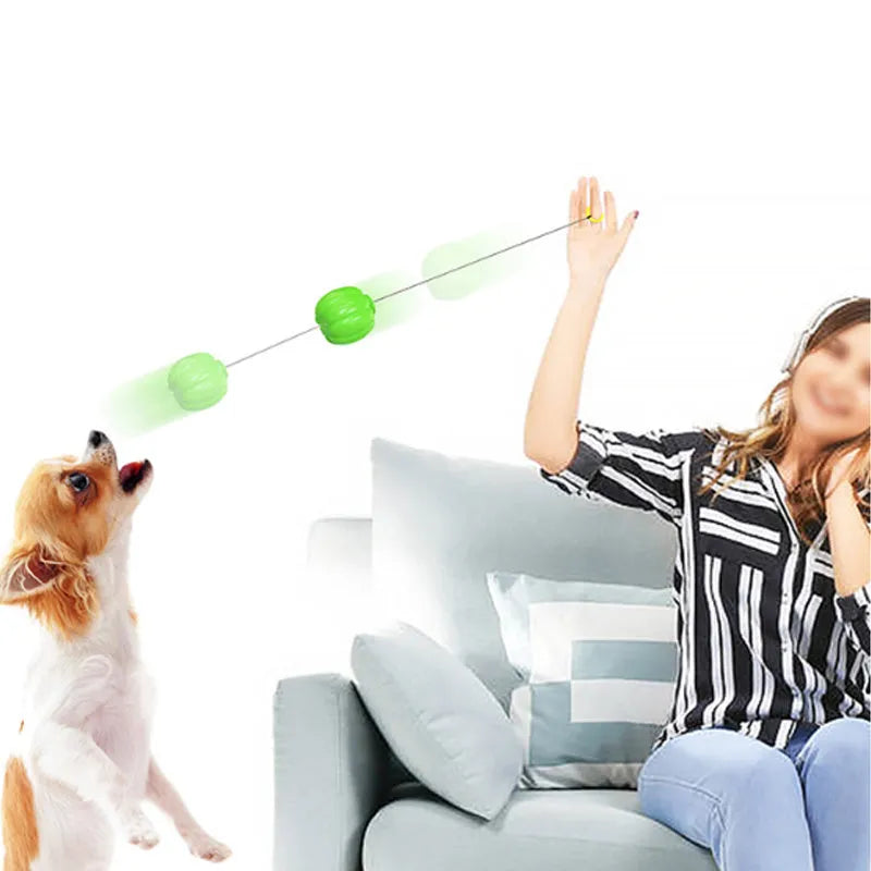 Green, orange, and yellow plastic pumpkin dog chew toy with squeaker for small dogs.