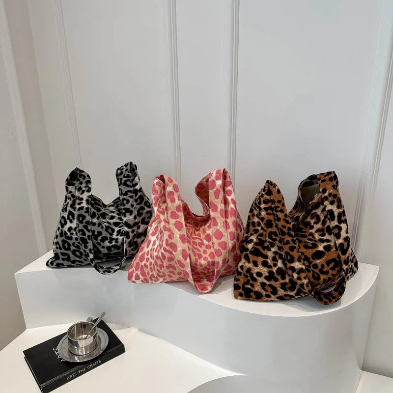 Leopard print shoulder messenger bag with square vertical shape and single strap, available in black, brown, and pink