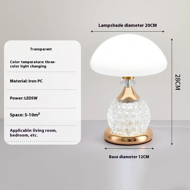 Light luxury mushroom table lamp with carved base in transparent colour on a wooden bedside table