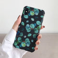 Black silicone leaf design phone case for iPhone models on a plain background.