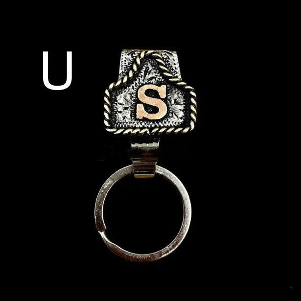 Handmade metal keychain with a cow tag charm in one of 26 available colour options.