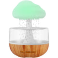 White cloud-shaped humidifier with coloured lights and water droplets