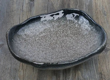 Japanese-style irregular shaped ceramic sashimi bowl with floral decorations measuring 24x21.5x7.5cm
