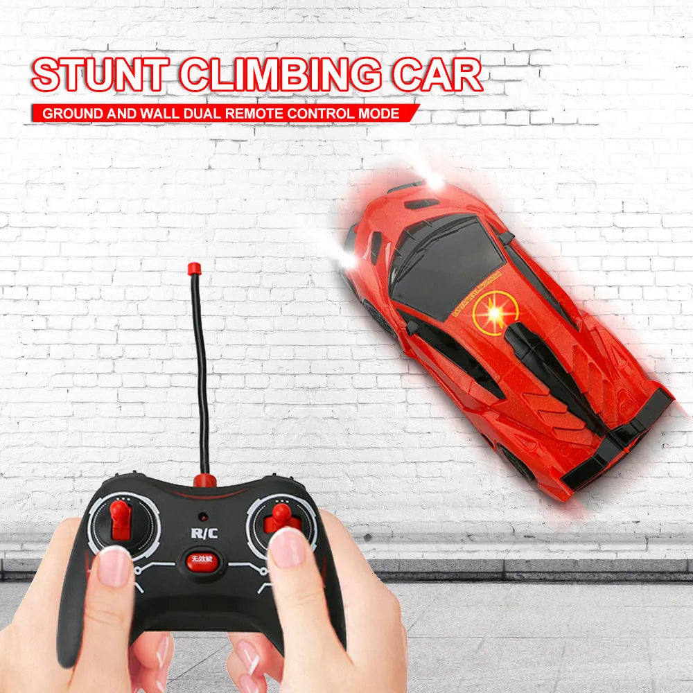 Remote control wall climbing car in red with industrial fan vents and white adsorbent strip on bottom, 1/28 scale
