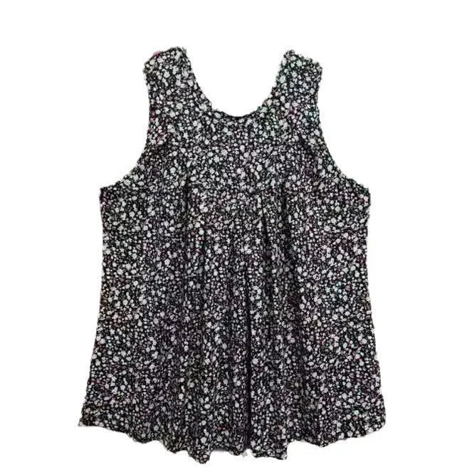 Black floral print sleeveless vest on hanger showing round neck and loose fit design