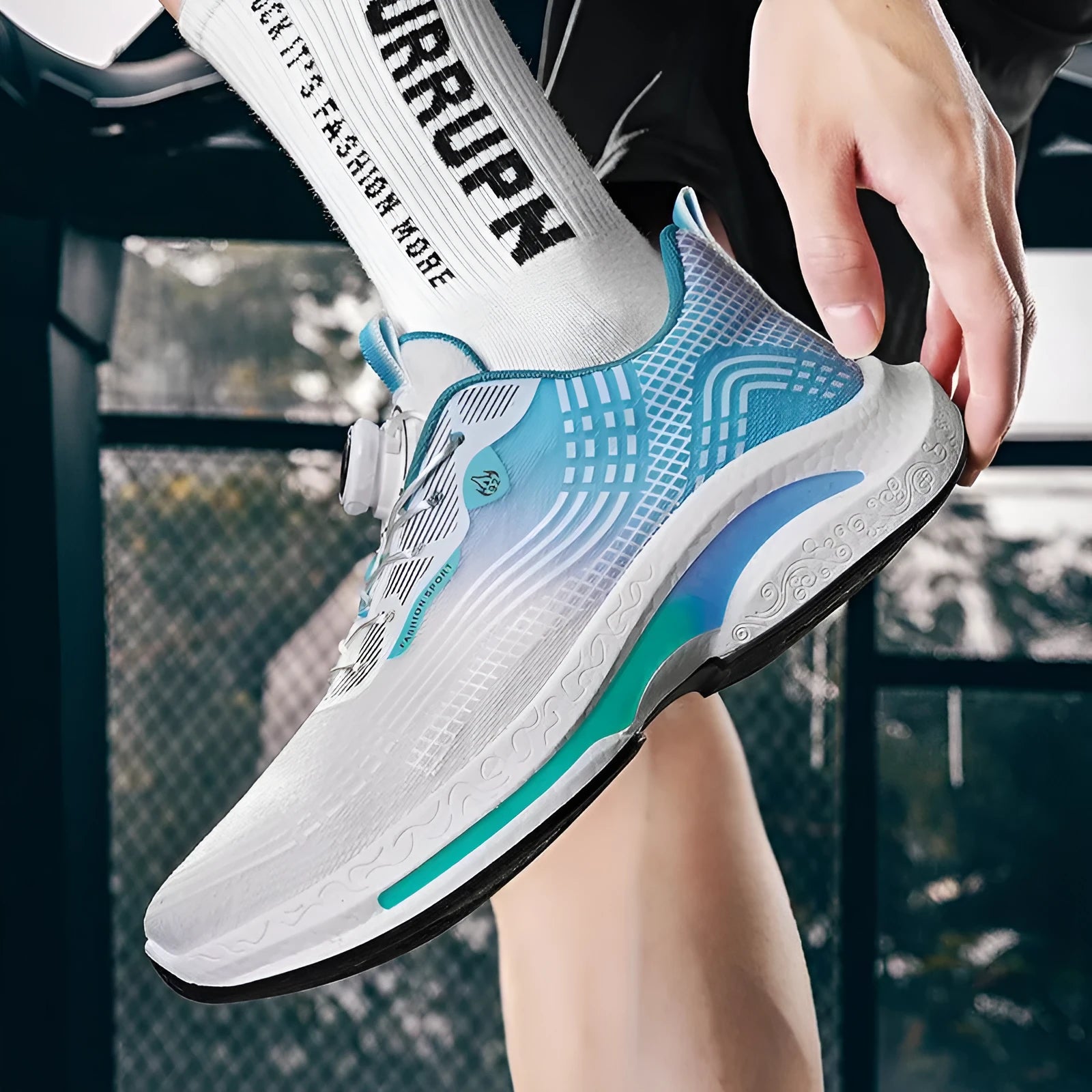 Men's white and blue mesh sneaker with a rotating buckle closure and rubber sole