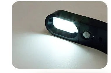 USB human body induction night light with light control, black colour, warm style LED lamp on bedside table