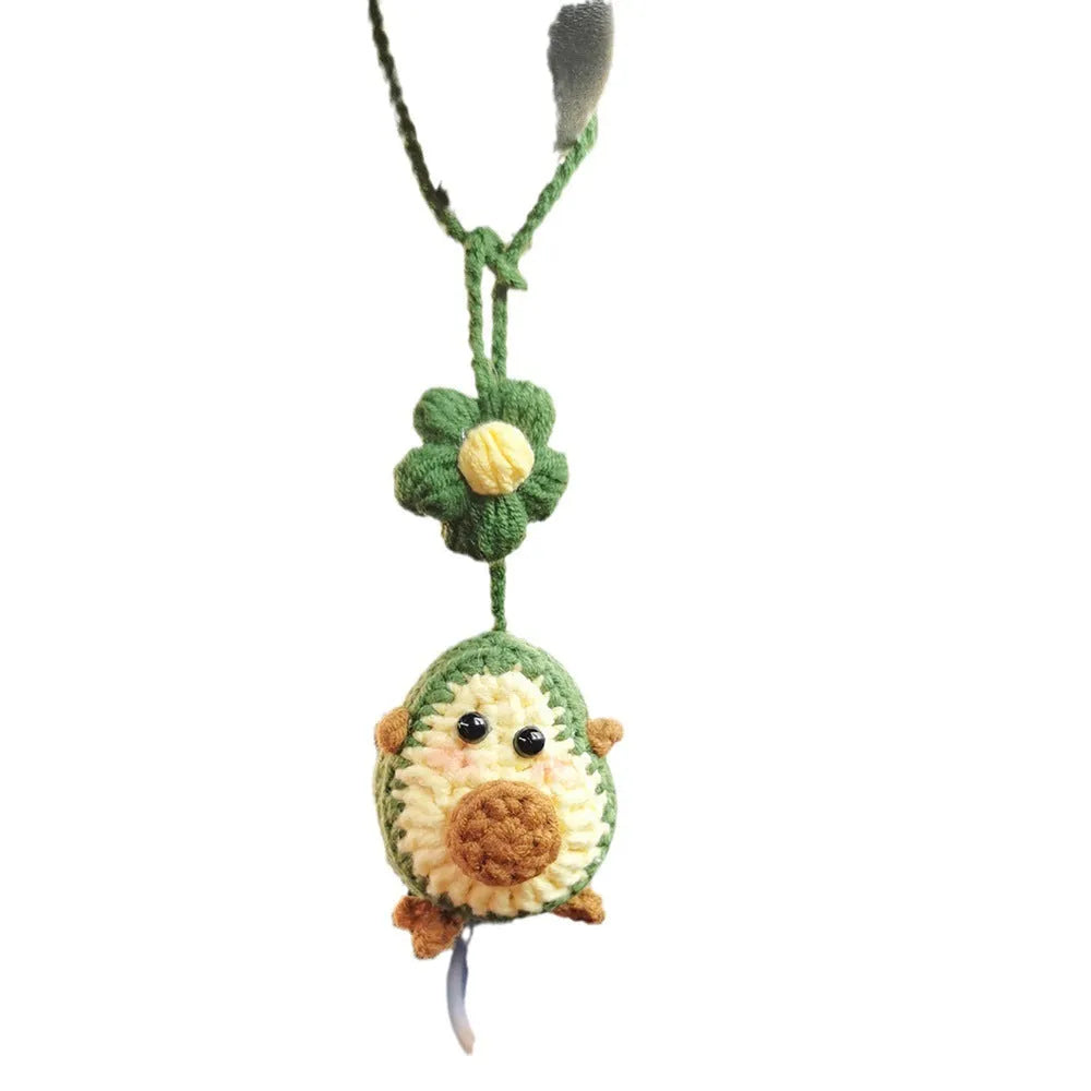 Handmade crocheted rainbow flower car pendant in wool with colourful avocado, pink, and red patterns