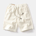 Men's khaki cargo shorts with retro American street style and straight-leg cut