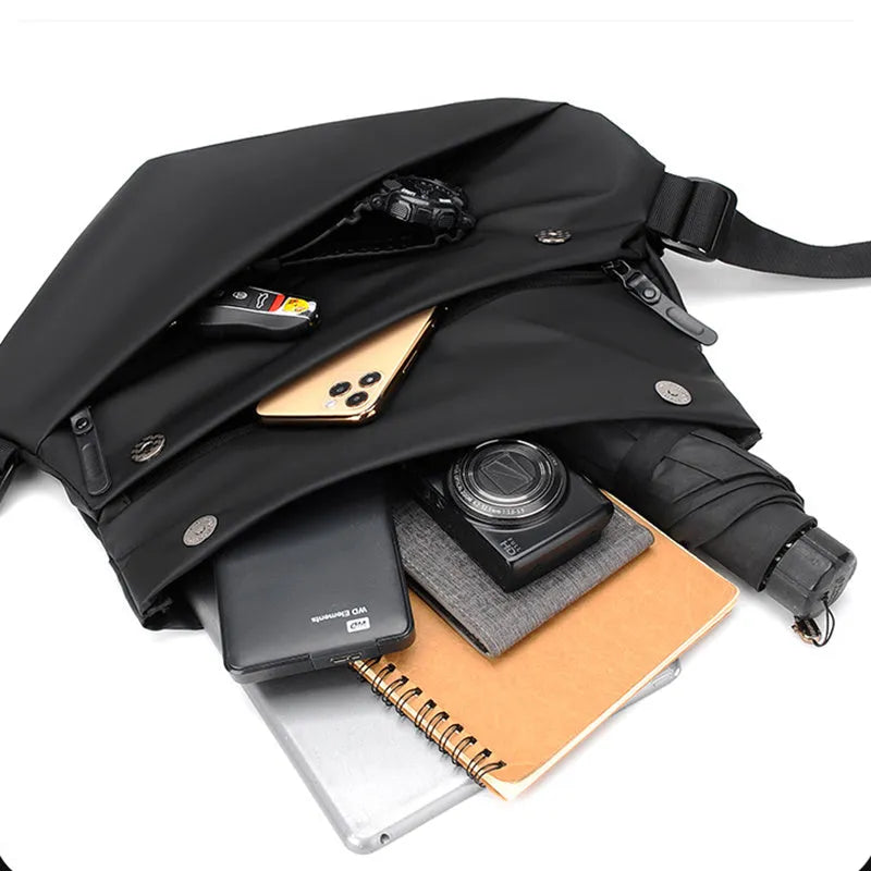 Grey medium-sized PU leather crossbody sling bag for men with a horizontal square shape.
