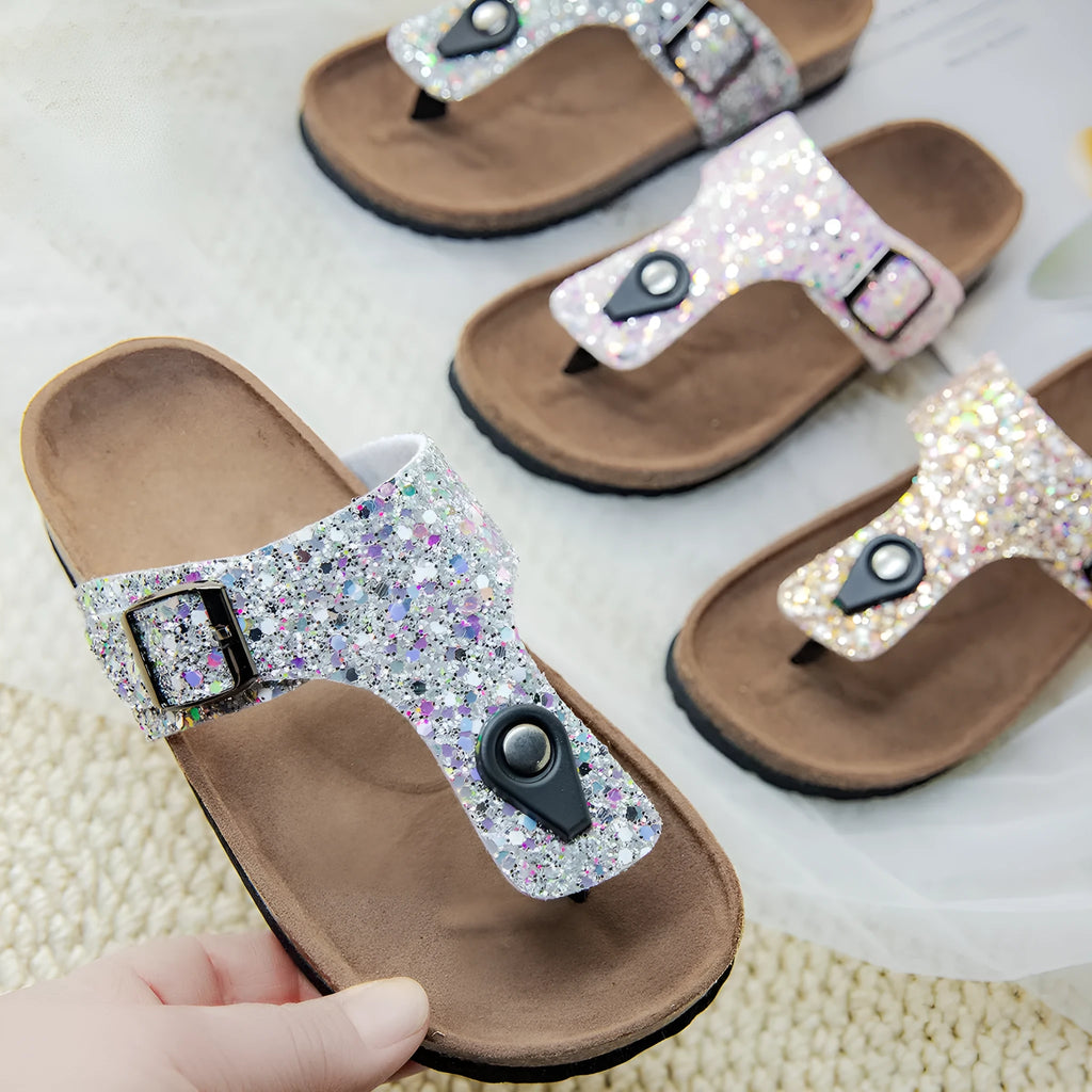 Women's cork flip-flops with frosted metallic artificial leather upper and textured PVC sole.