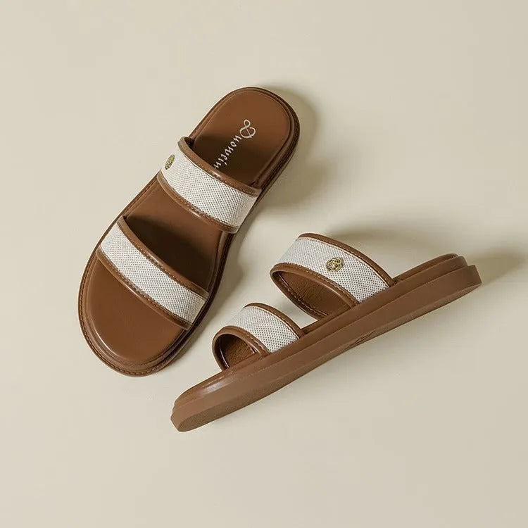 Women's vintage brown and black soft-bottom flip-flops made from artificial PU leather, showing retro strap design.