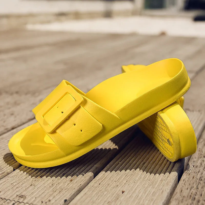 Women's grey blue buckle fastening flip-flop sandals with a soft EVA sole on a white background.