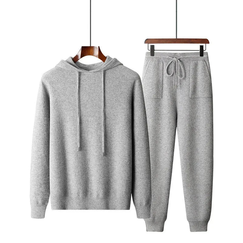 Men's light grey cashmere hooded sweatshirt and matching long pants set laid flat.
