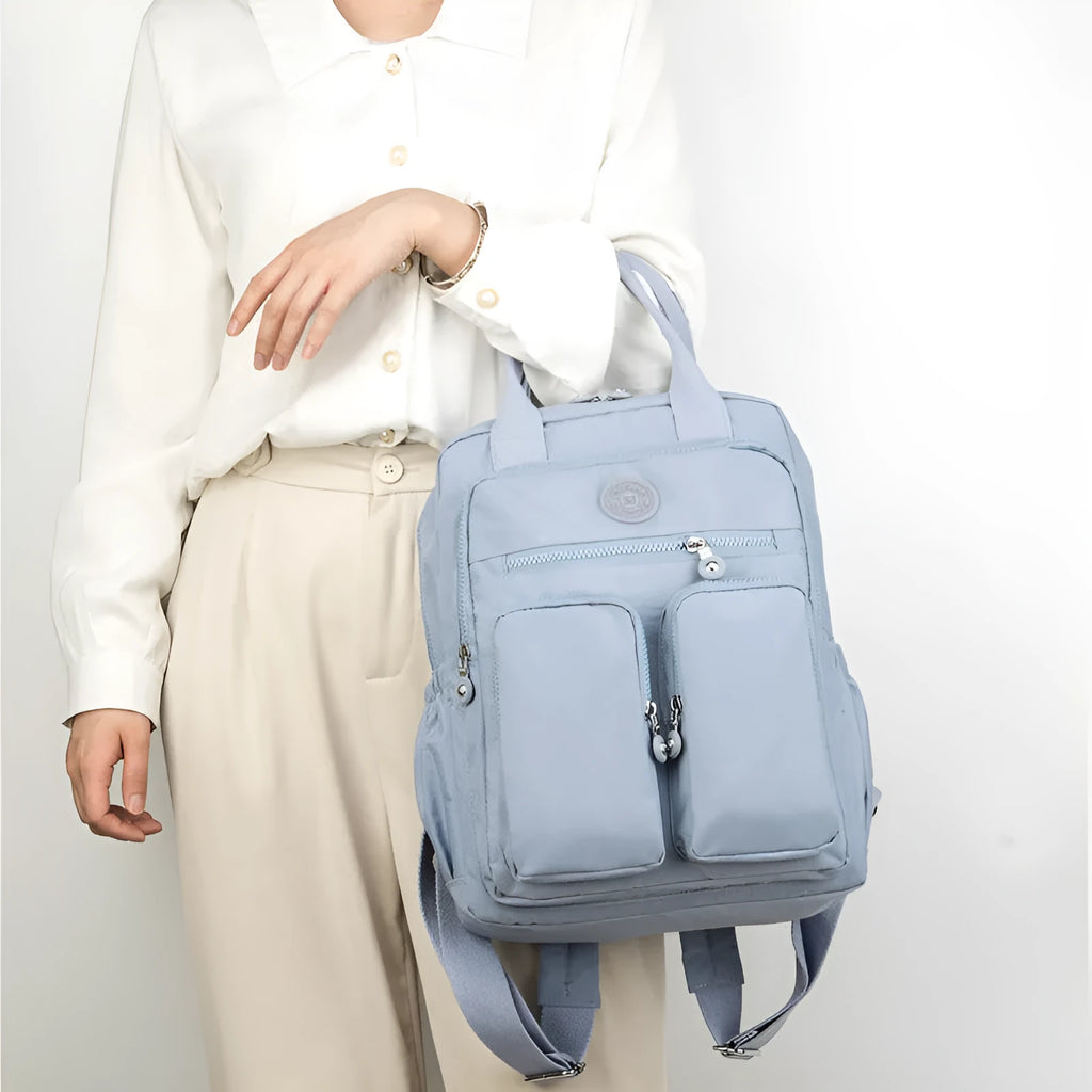 Women's waterproof nylon travel backpack with multiple internal compartments in various colours