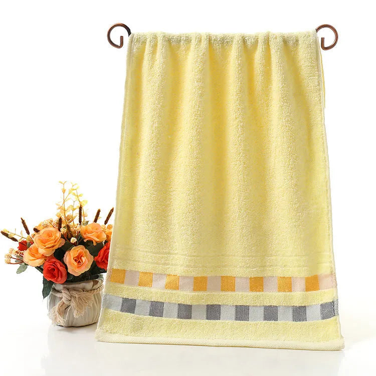 Cotton face towel 73x33cm in blue pink yellow patterns on hanger