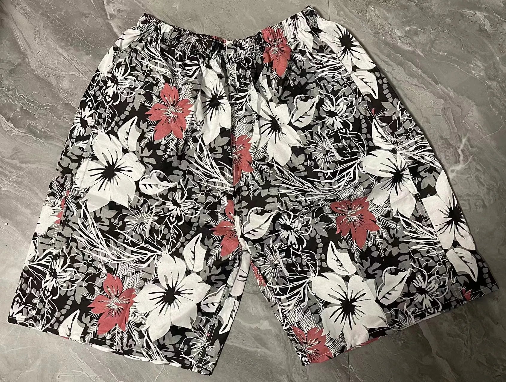 Men's floral print five-point swimming trunks in polyester fabric, free size
