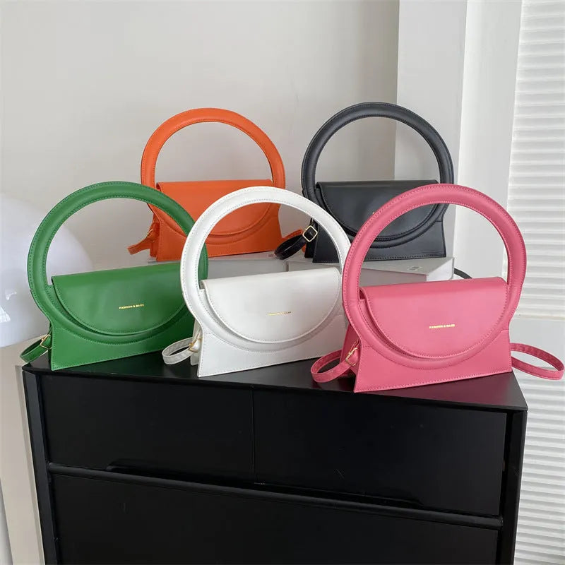 PU leather shoulder messenger bag with sandwich pockets and decorative stitching in five colour options