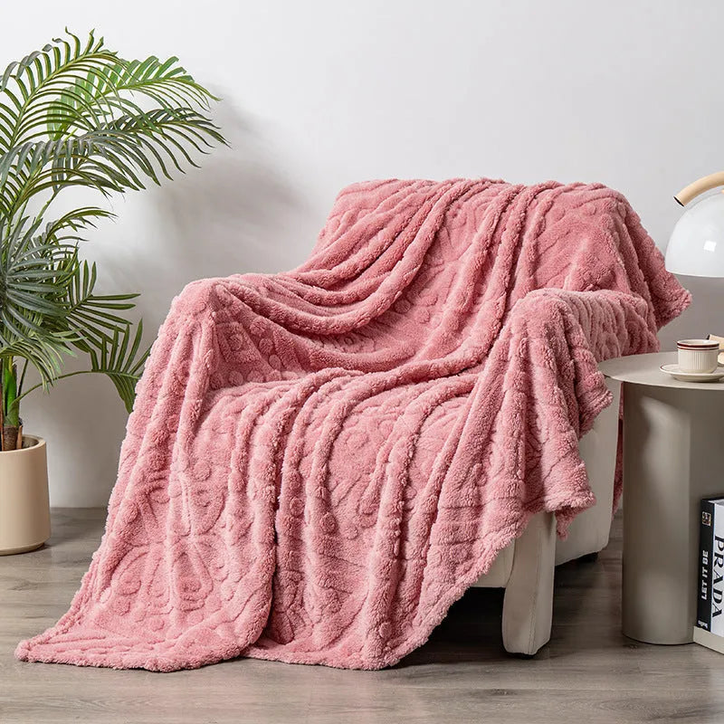 Shu Cotton Velvet Jacquard blanket in fog blue with a woven plant flower pattern, laid flat.
