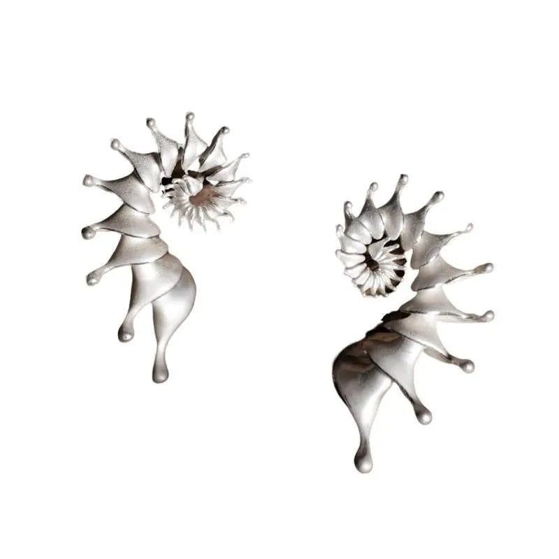 Three-dimensional matte conch stud earrings with irregular geometric shapes