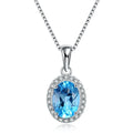 Four-piece 925 sterling silver jewellery set with blue topaz gemstones in a geometric design, showing earrings, ring, pendant and necklace.