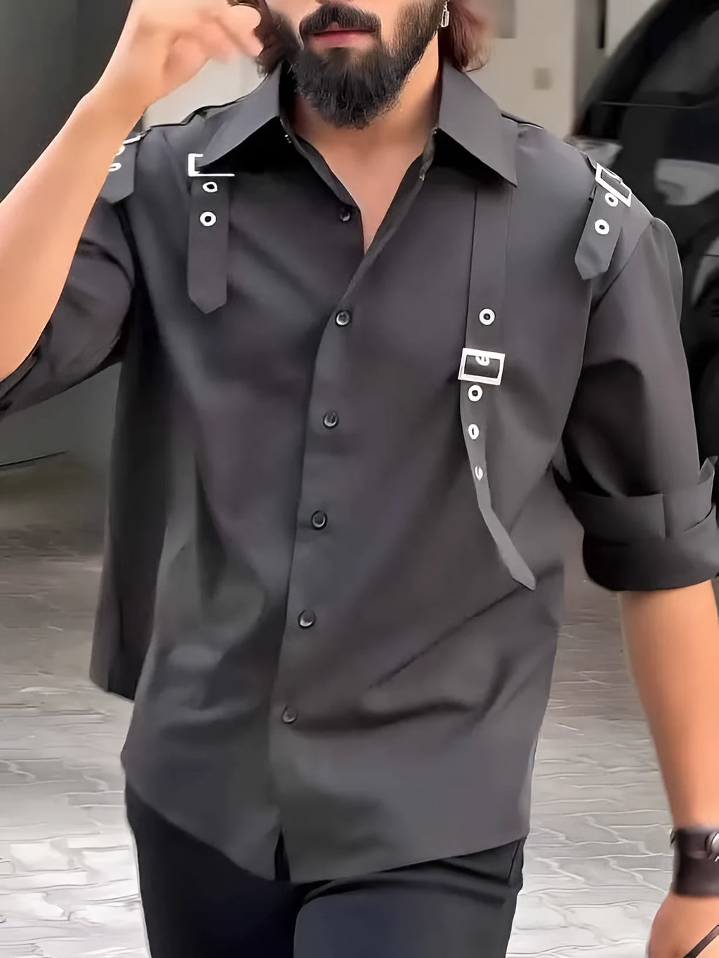 Man wearing a black regular-fit polyester button-up shirt for casual daily wear.