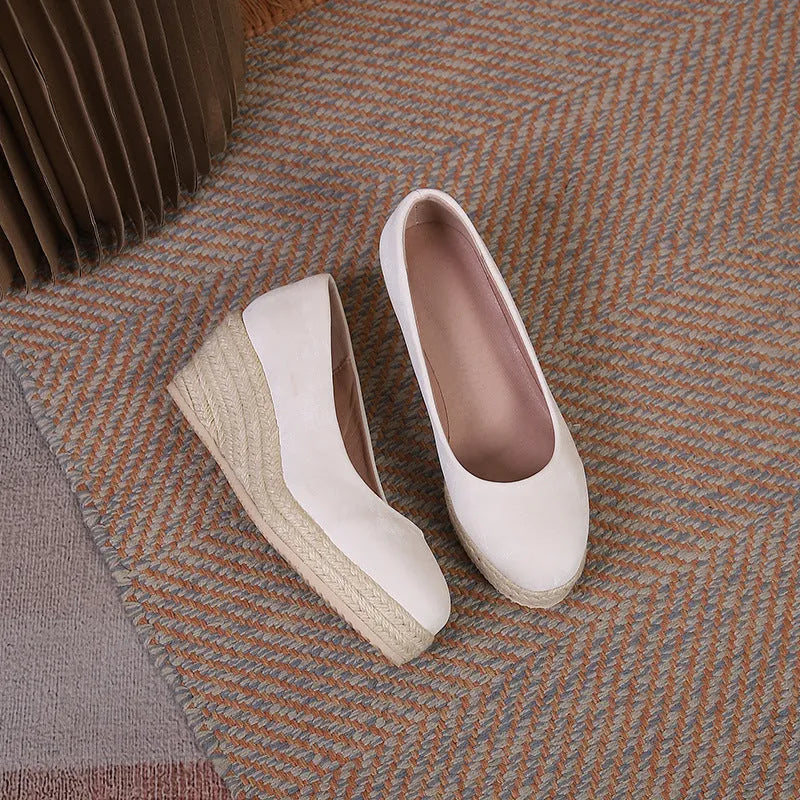 Apricot wedge high heel pumps with thick sole, rope heel detail, and shallow mouth.