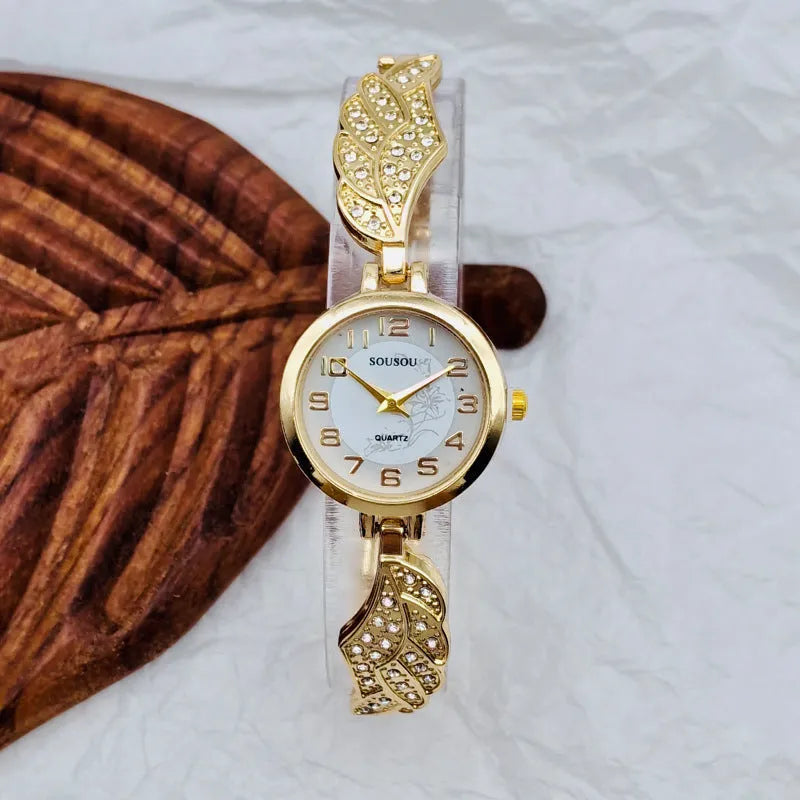 Stainless steel women's watch with round dial on a wrist, showing the Vachette clasp buckle.