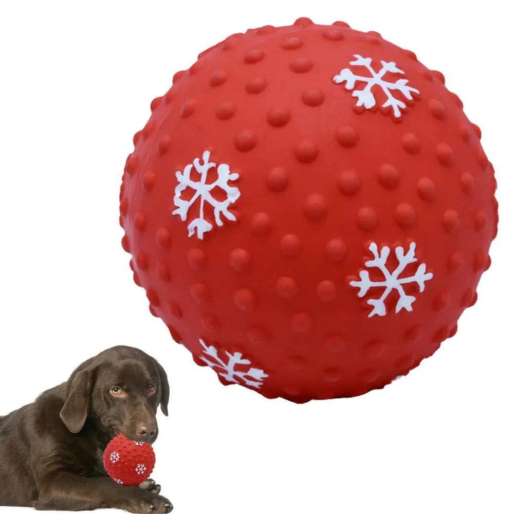 Red dog toy ball with squeaker and air vents, 7 cm diameter, floating on water