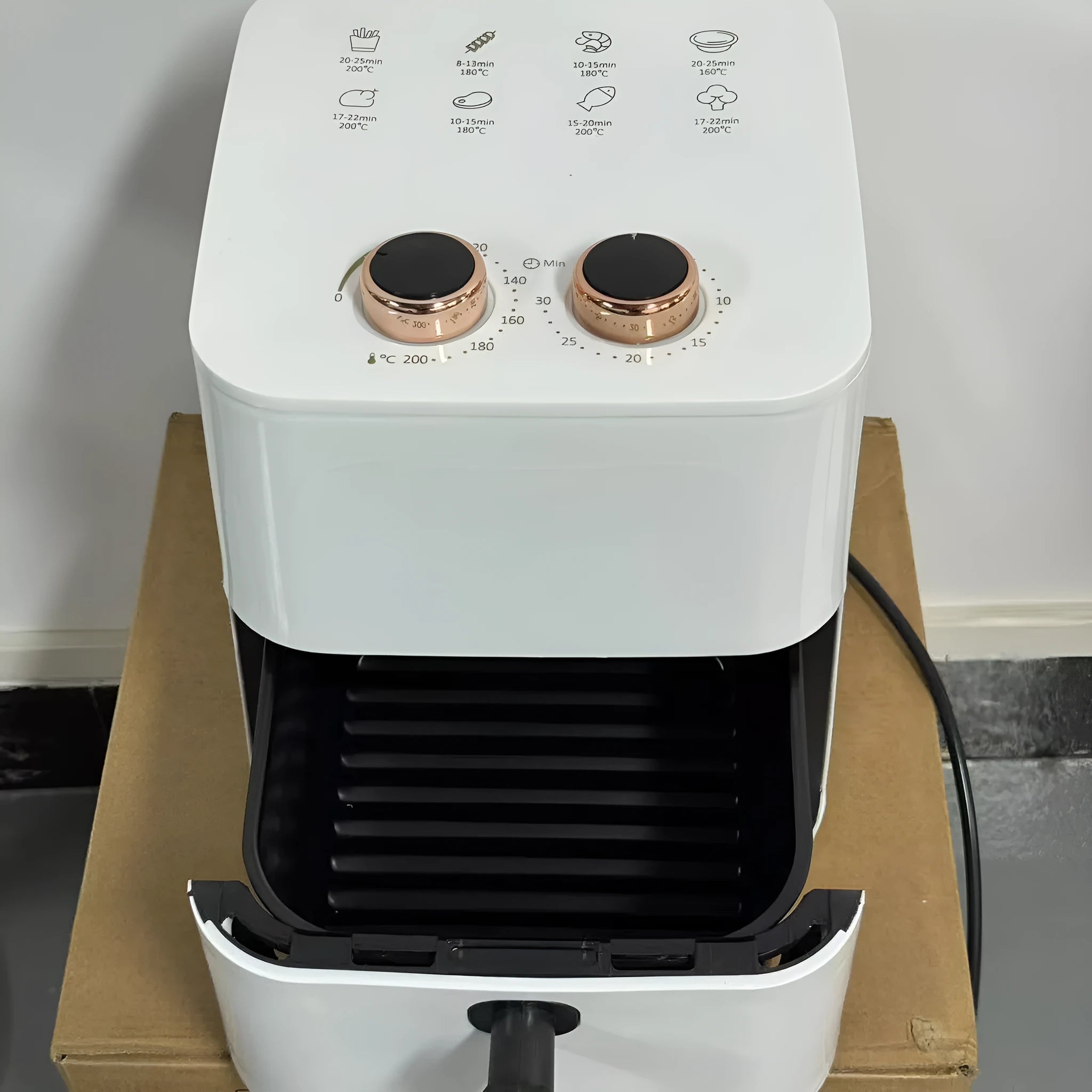 5.5-litre digital air fryer in black with touch screen controls and cooking basket