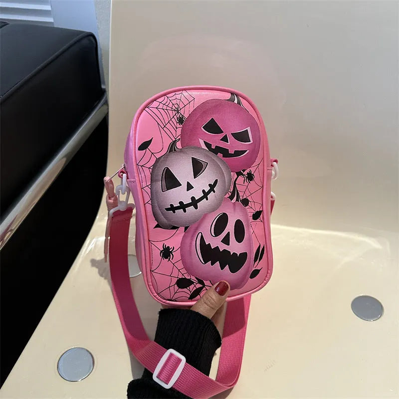 Black Halloween graffiti crossbody bag with pumpkin, ghost, and bat print