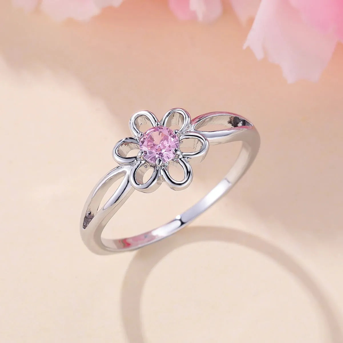 Women's hollow floral fashion ring in electroplated copper with a choice of metallic finishes.