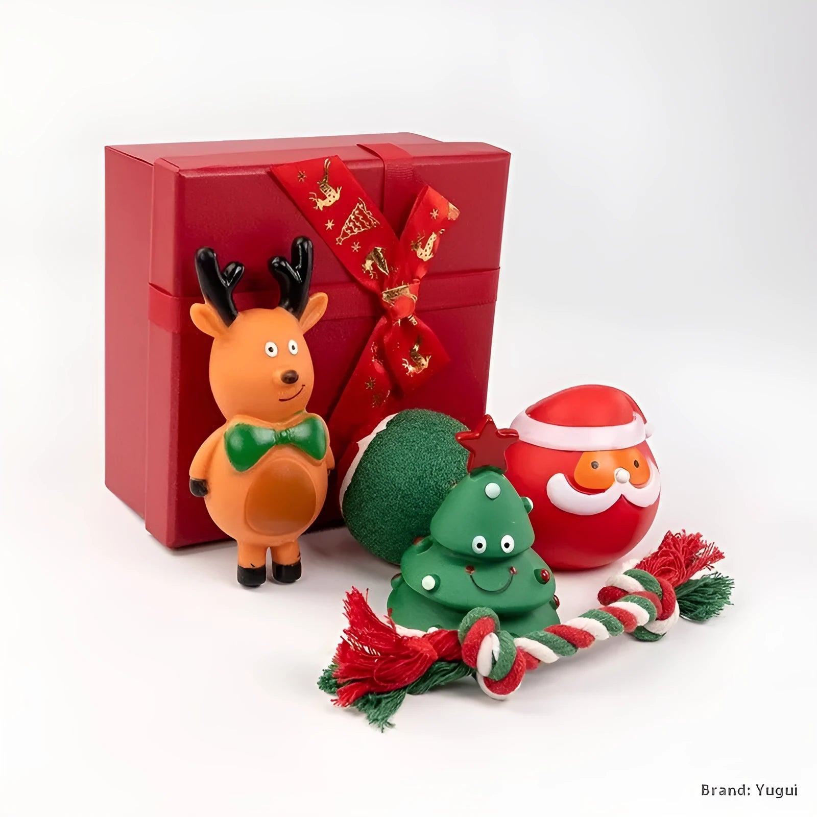 Christmas-themed vinyl dog toys including barbell, ball, rope, and Santa designs in gift packaging