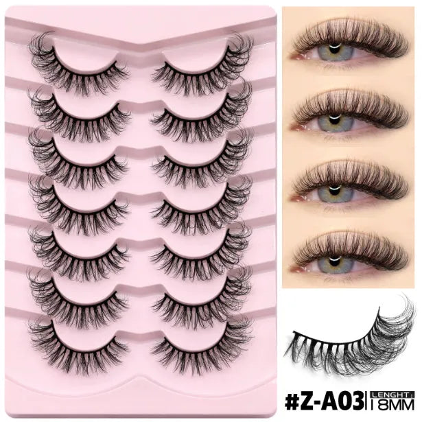 Box of natural long, thick false eyelashes made from artificial fibre with included glue tube.