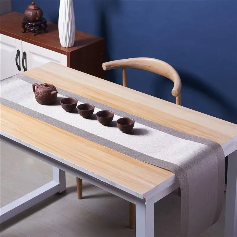 PVC non-slip dish mat in modern simple style on a dining table, showing gradient bamboo black colour option.