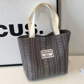 Japanese-style corduroy shoulder bag in dark brown, showing the textured fabric and adjustable strap.