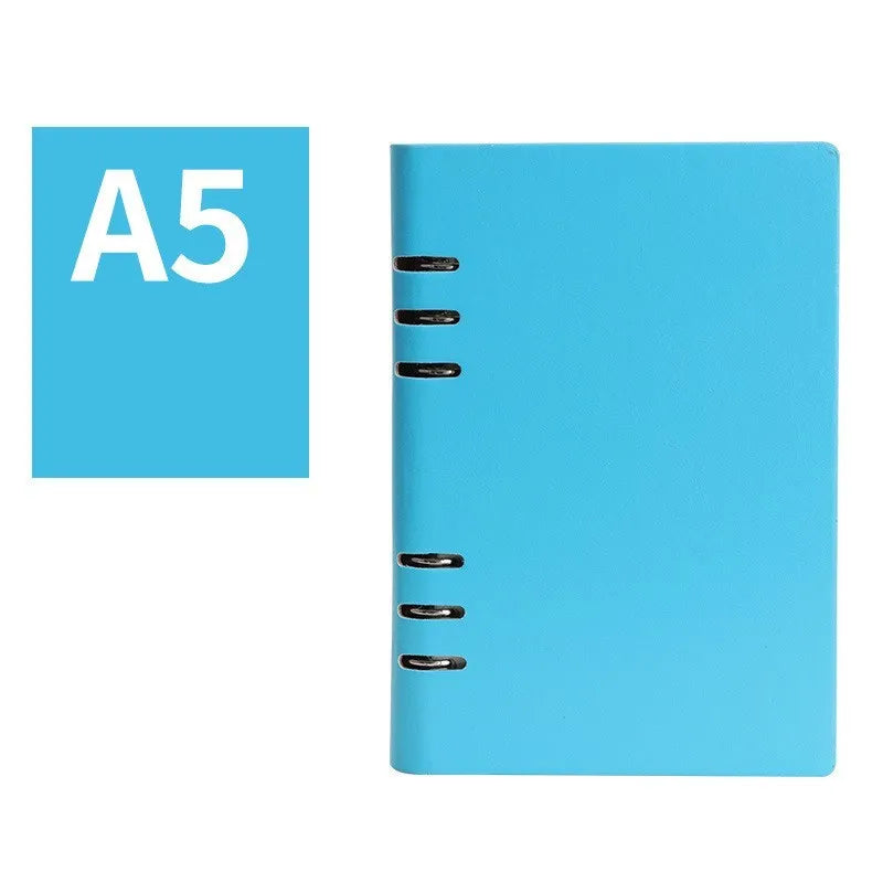 Simple business notebook with imitation leather cover showing loose-leaf binding and beige road forest paper