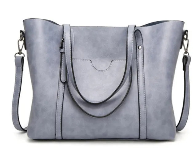 Retro style women's messenger bag in PU leather, shown in light blue colour