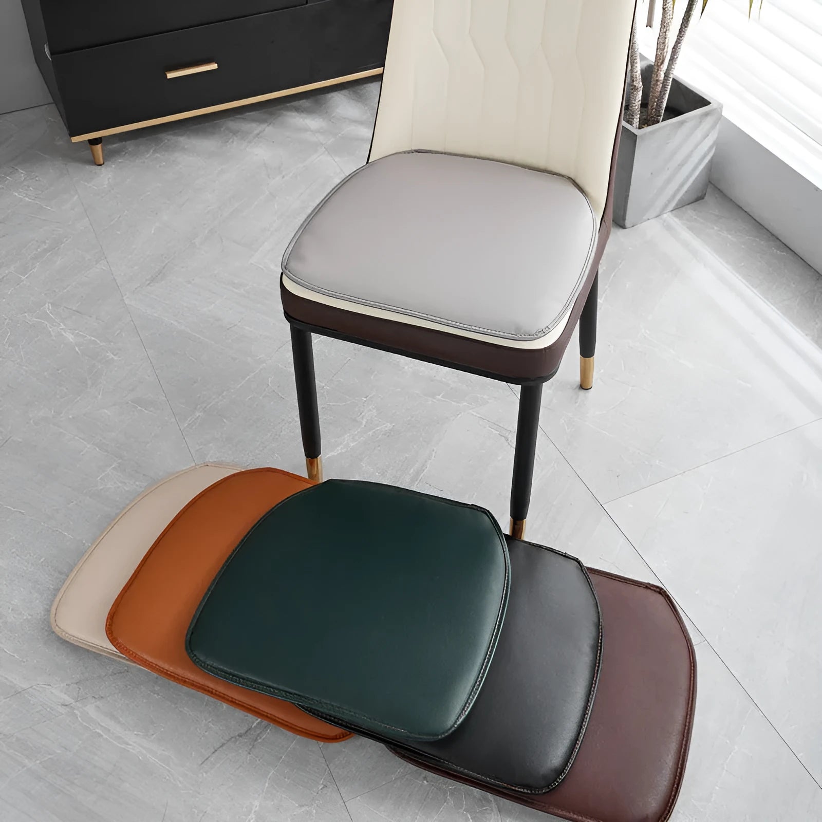 Leather horseshoe-shaped seat cushion in beige colour on a wooden chair, showing non-slip base