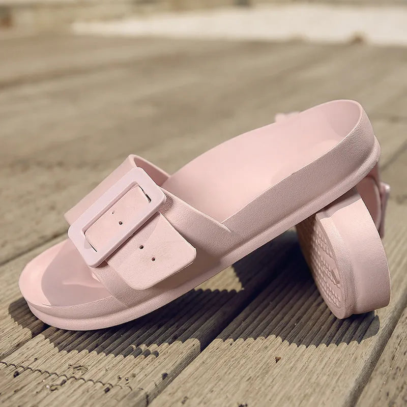 Women's grey blue buckle fastening flip-flop sandals with a soft EVA sole on a white background.