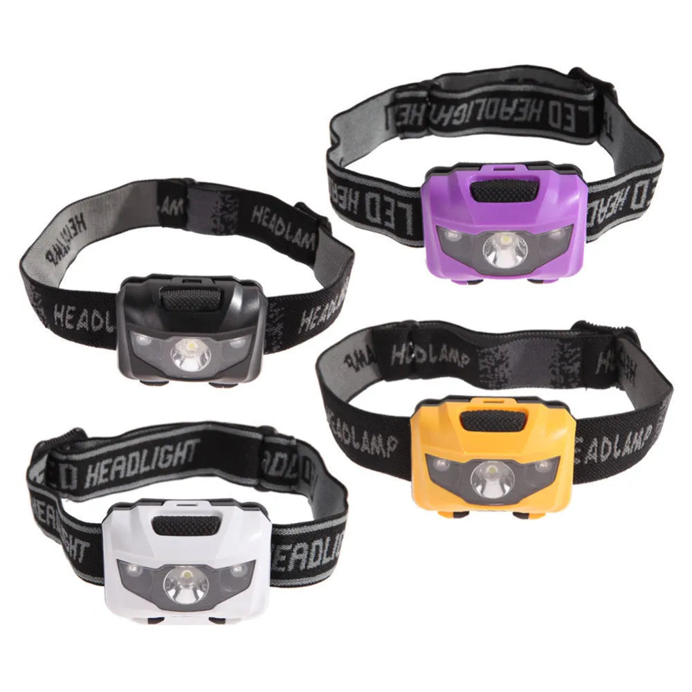 Black head torch with white and red LEDs mounted on an adjustable head strap for outdoor use.