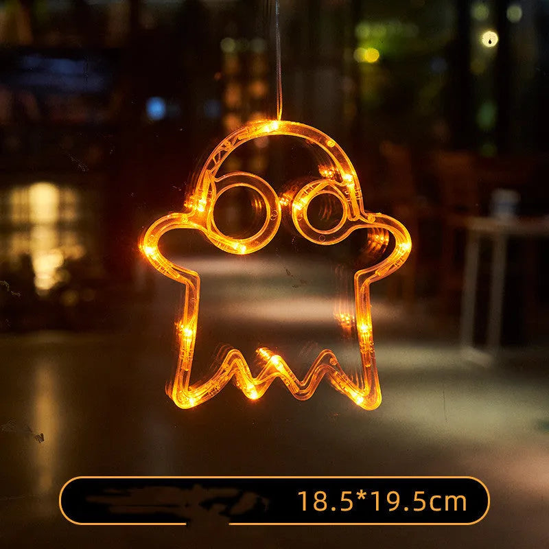 Seven Halloween LED window lights with spider, pumpkin and ghost designs on suction cups