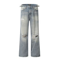 Denim blue straight-leg jeans with ripped details and zip fly closure