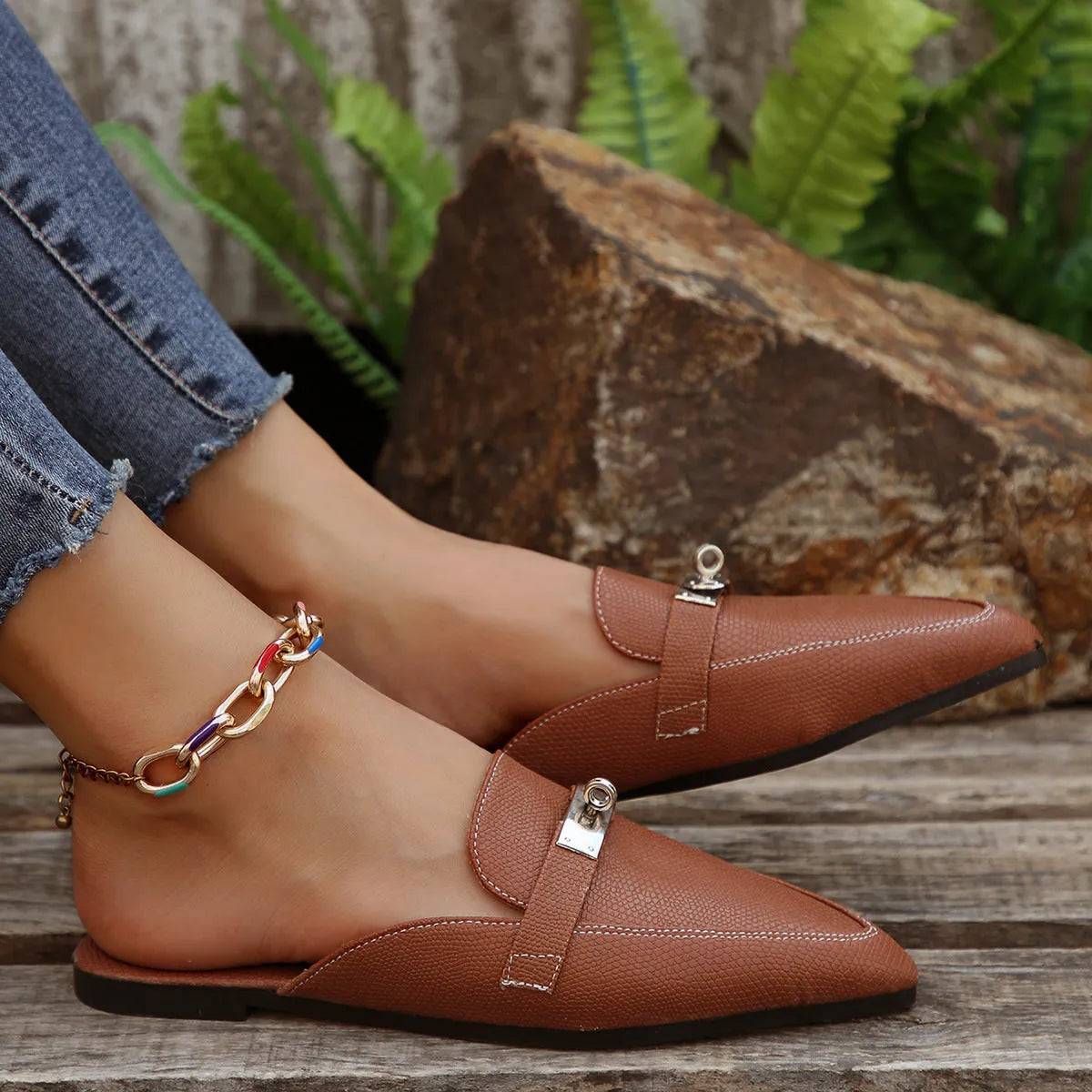 Light brown women's pointed-toe semi-slippers with a low heel and rubber sole