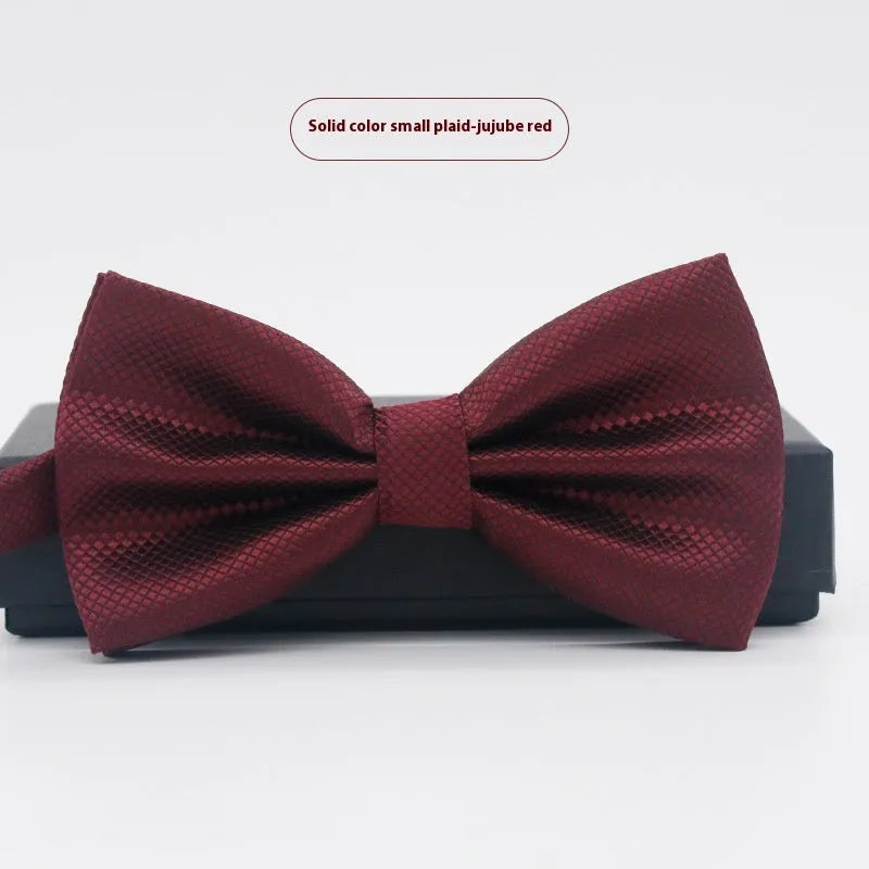 Solid colour polyester bow tie with flat head design measuring 12cm by 6cm
