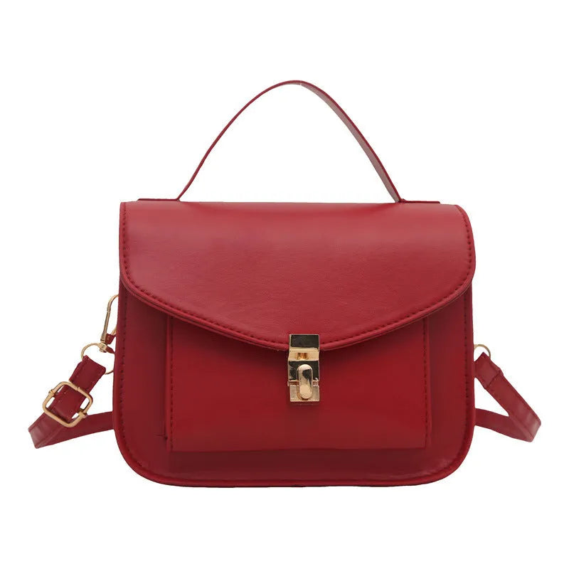 Retro style shoulder messenger bag in horizontal square shape with crossbody strap